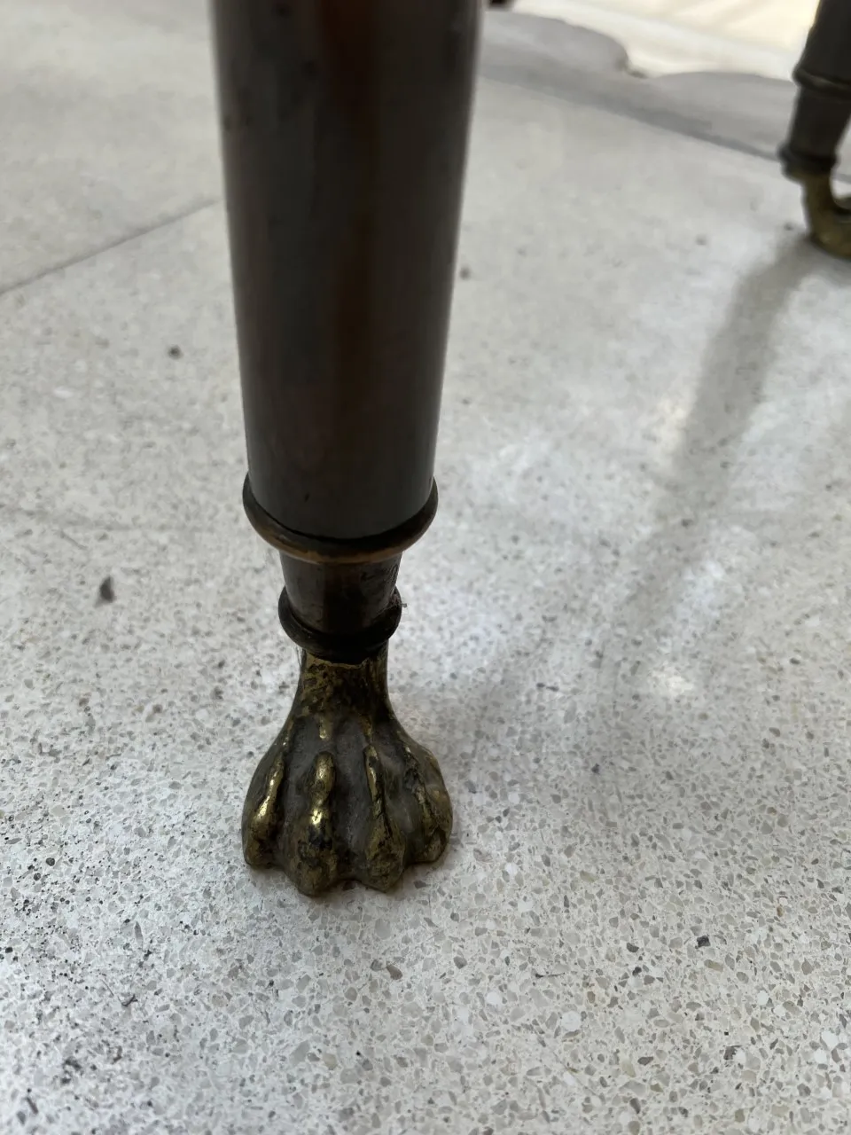 Close-up of antique console legs with decorative details