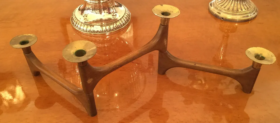 Antique candelabra with multiple arms in unique style.