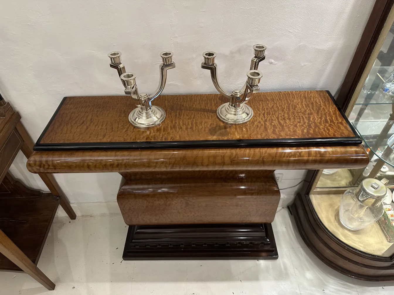 Antique candelabra on a table, stylish base and three arms