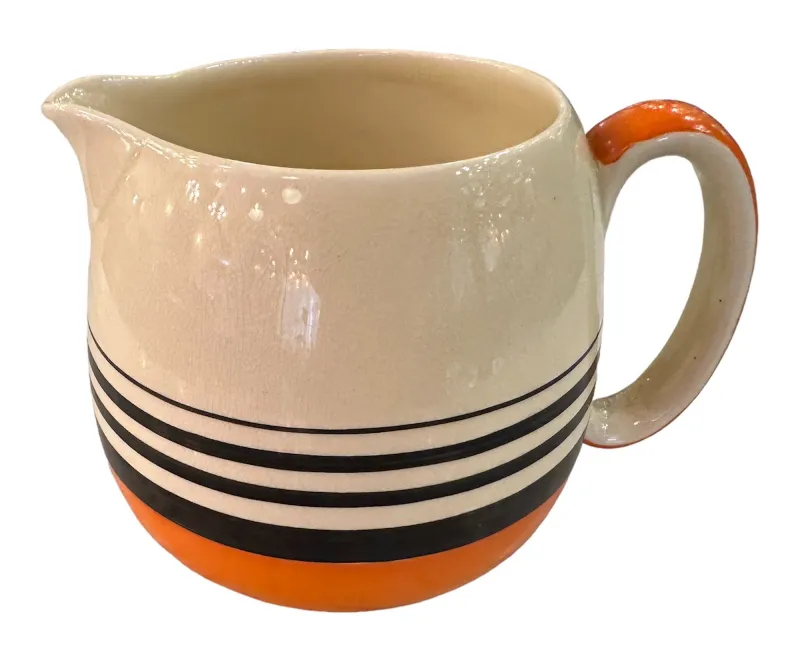 antique tea set featuring a colorful decorative pitcher