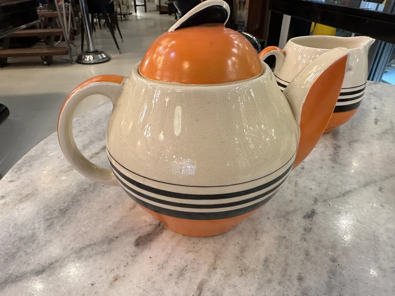 antique tea set featuring vibrant colors and stripes