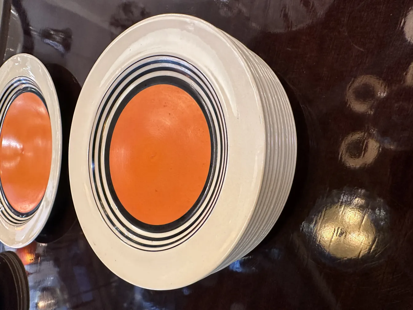 Antique tea set with colorful design in an elegant setting.