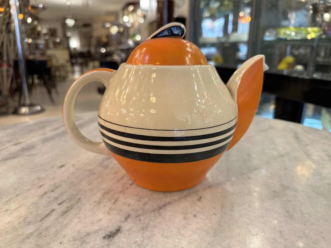 antique tea set with colorful design and large handle