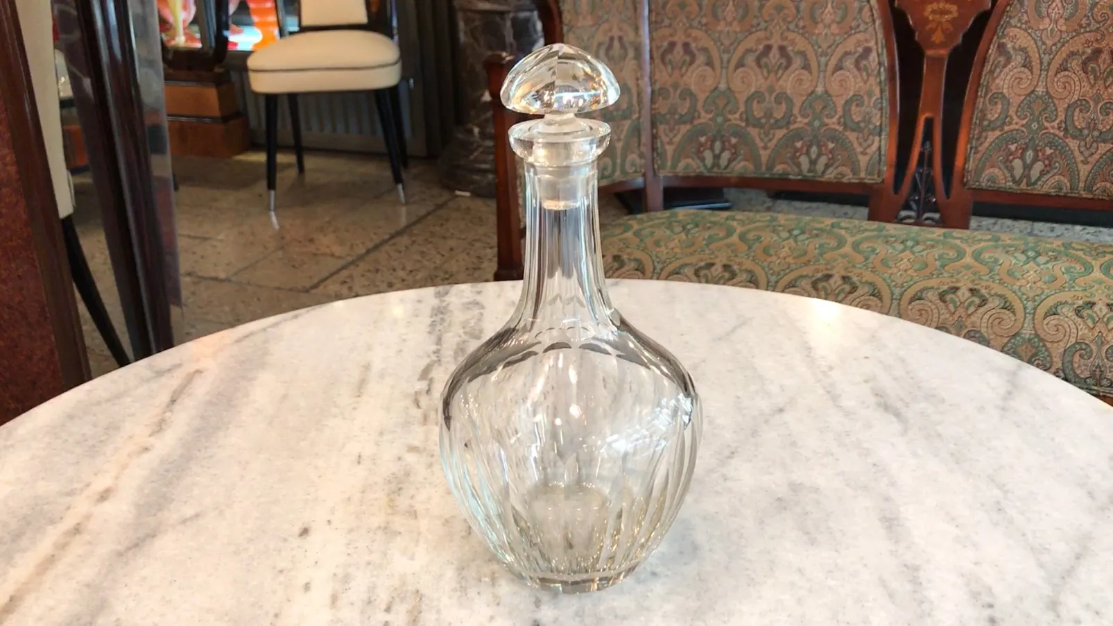 antique bottle with glass stopper in classic setting