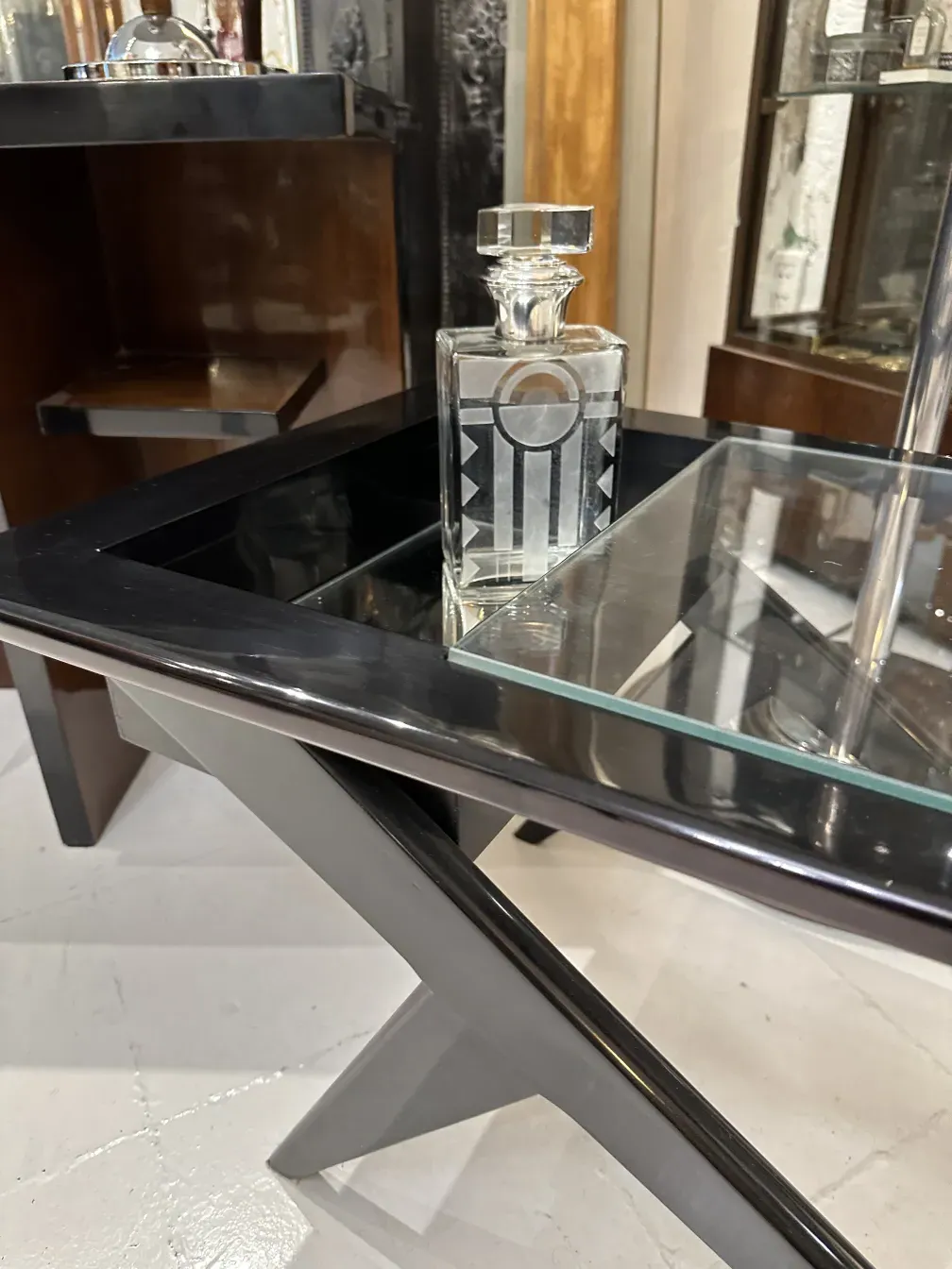 antique bottle with cap and bright geometric decoration on a shelf