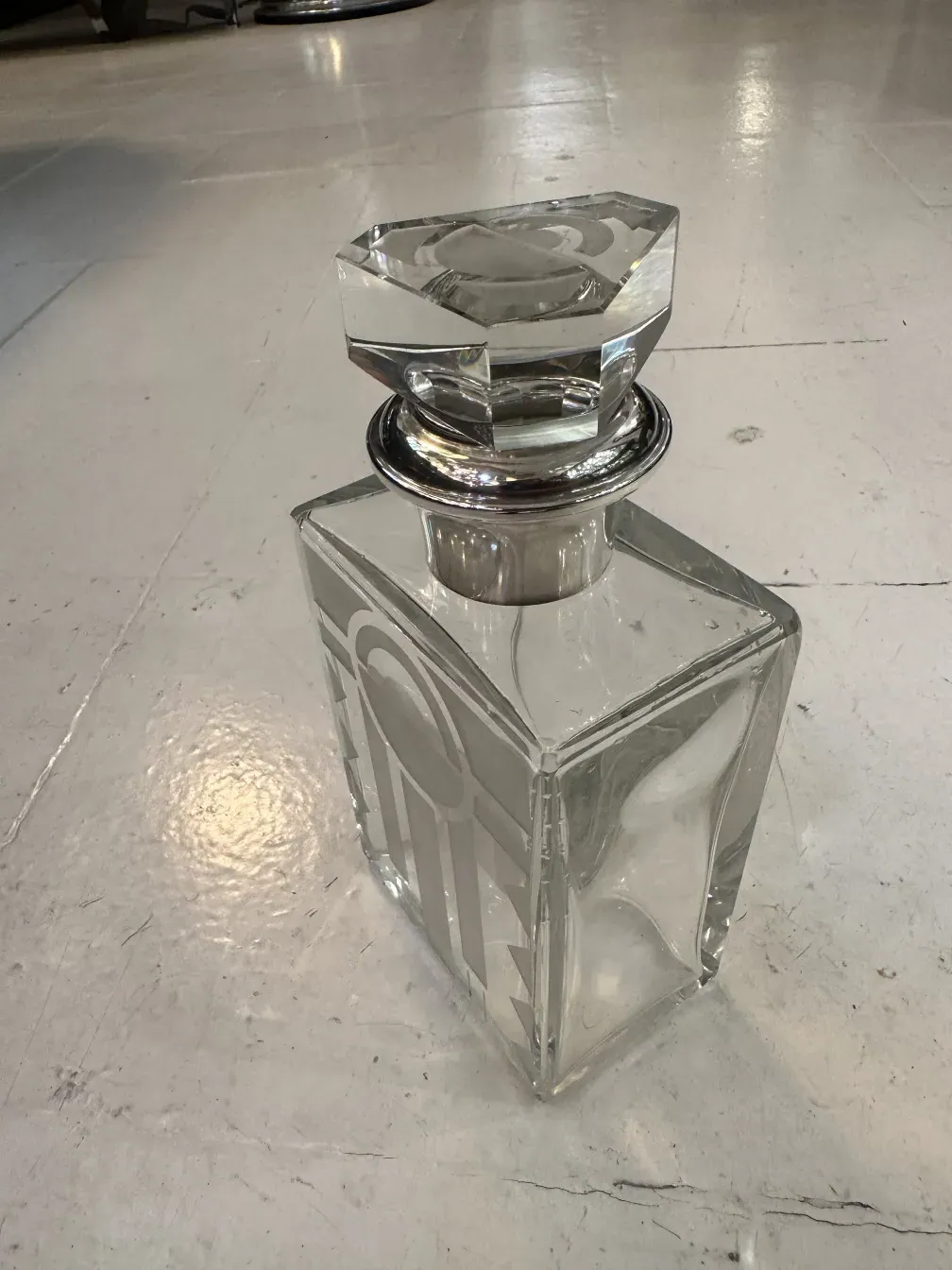 antique octagonal glass bottle with a stopper