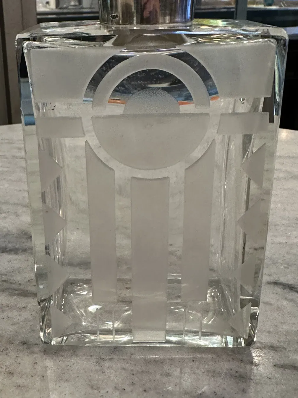 antique bottle with clear decoration and geometric shapes
