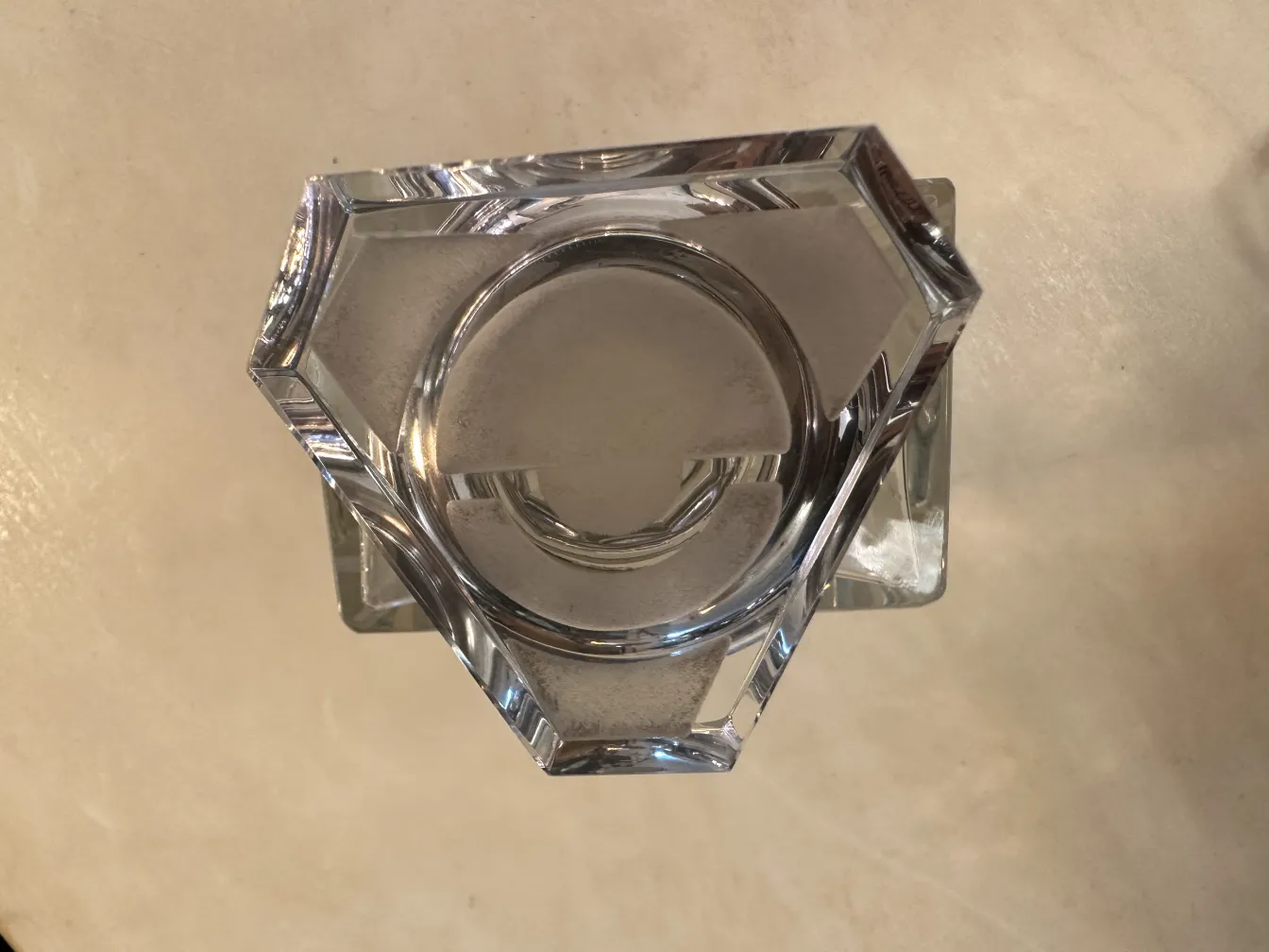 antique bottle with hexagonal design on light table