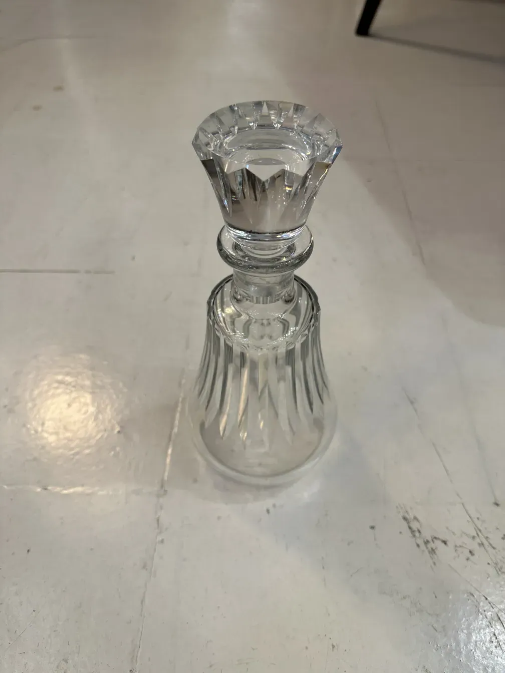 antique glass bottle with carved design