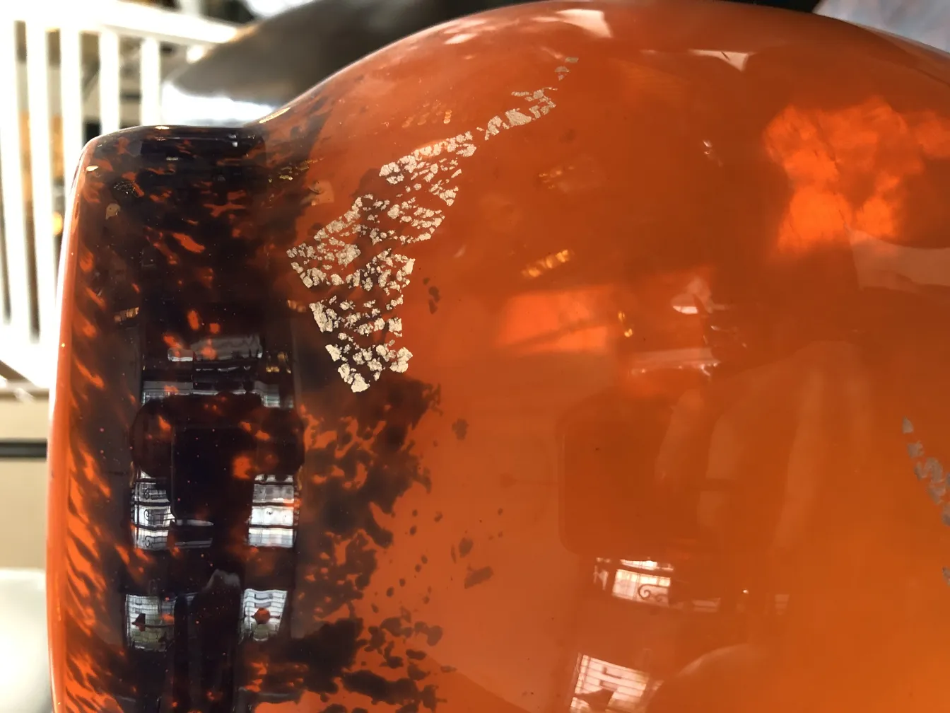 Antique signed glass by Muller Fres with unique patterns, vibrant color in a classic setting.