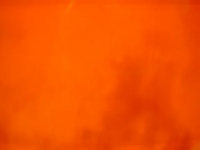 Signed glass by Muller Fres with orange background