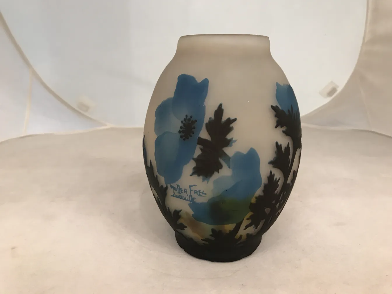 Signed glass by Muller Freres, featuring blue flowers and leaves