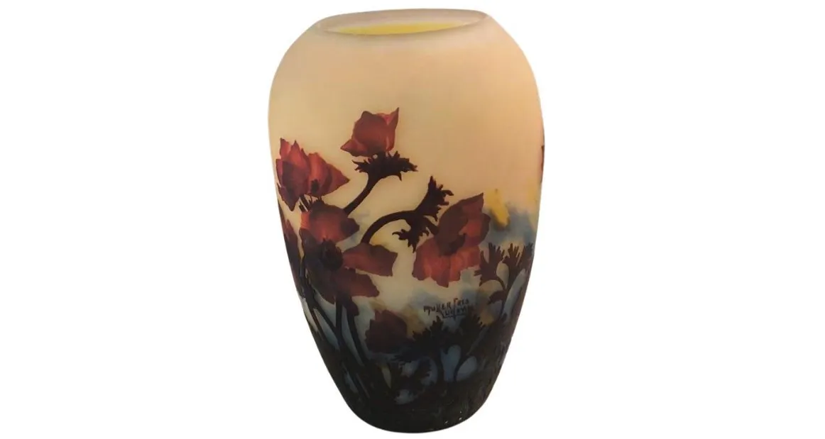 Antique vase with flowers and Muller Freres signature, colorful details.