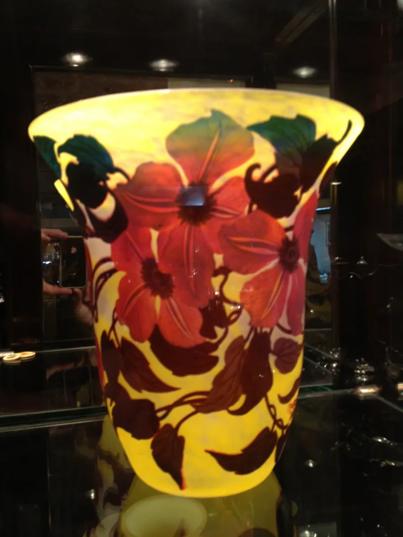 Antique vase with floral design by Muller Freres, featuring yellow and red hues.