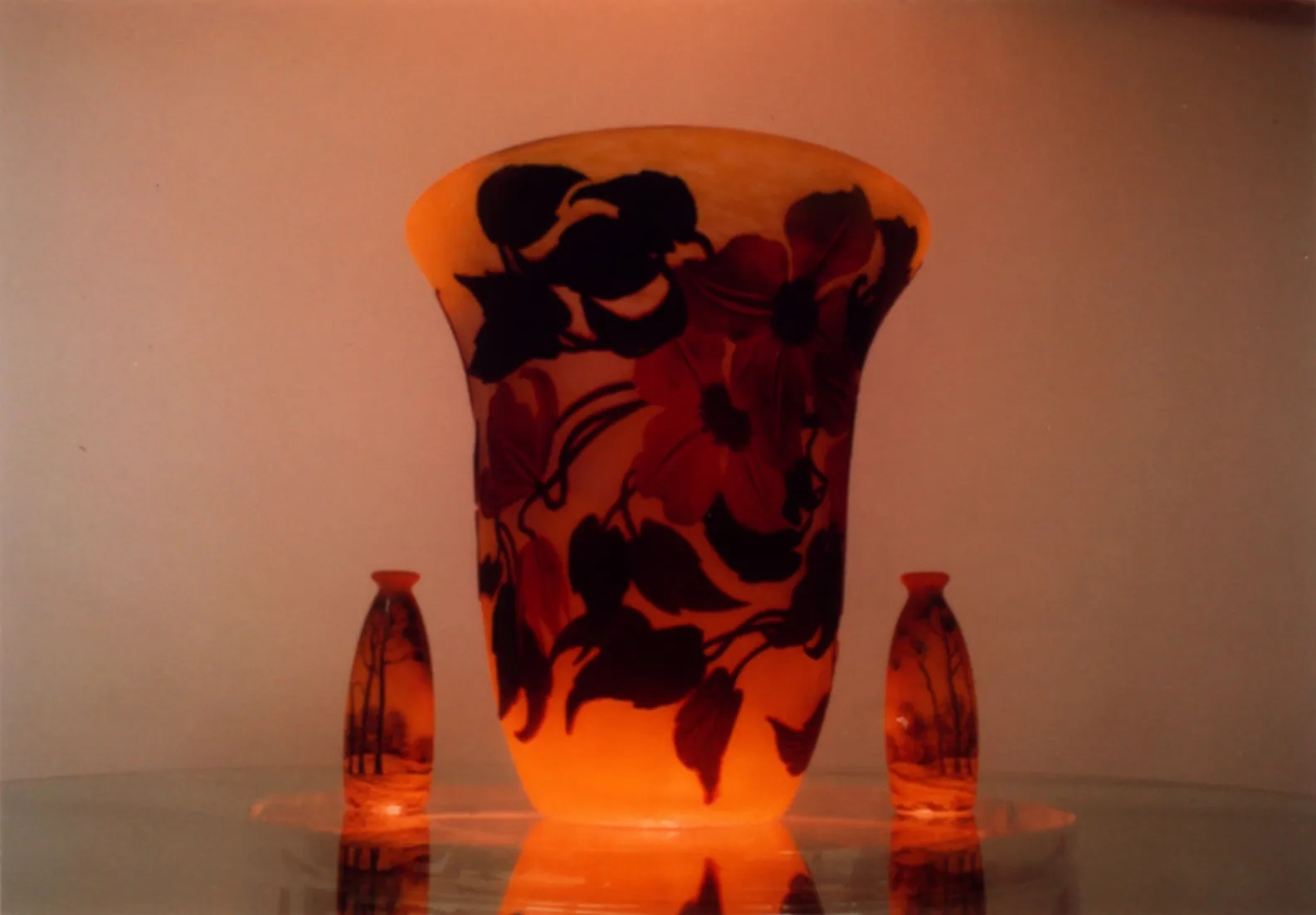 Decorative signed glass Muller Fres featuring floral patterns.