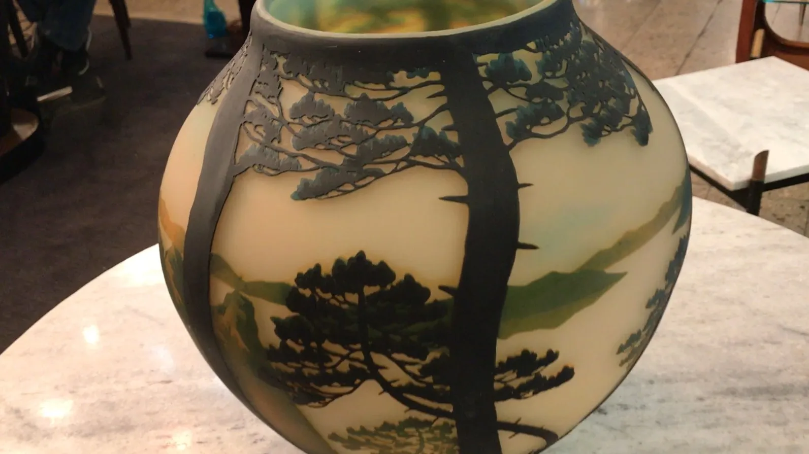 signed glass Muller Fres featuring tree design in an antique setting