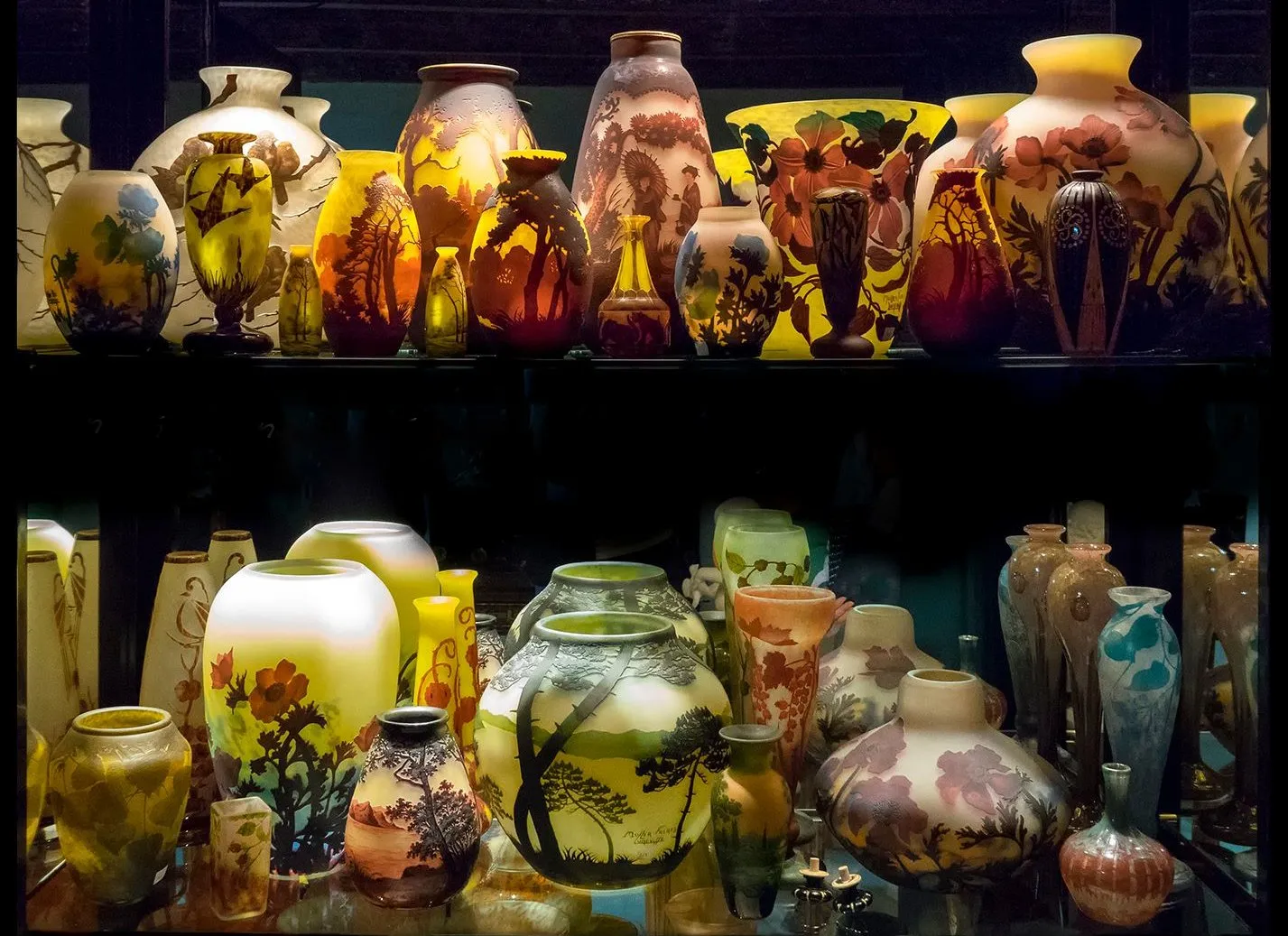 Collection of antique glass with various designs and colors.