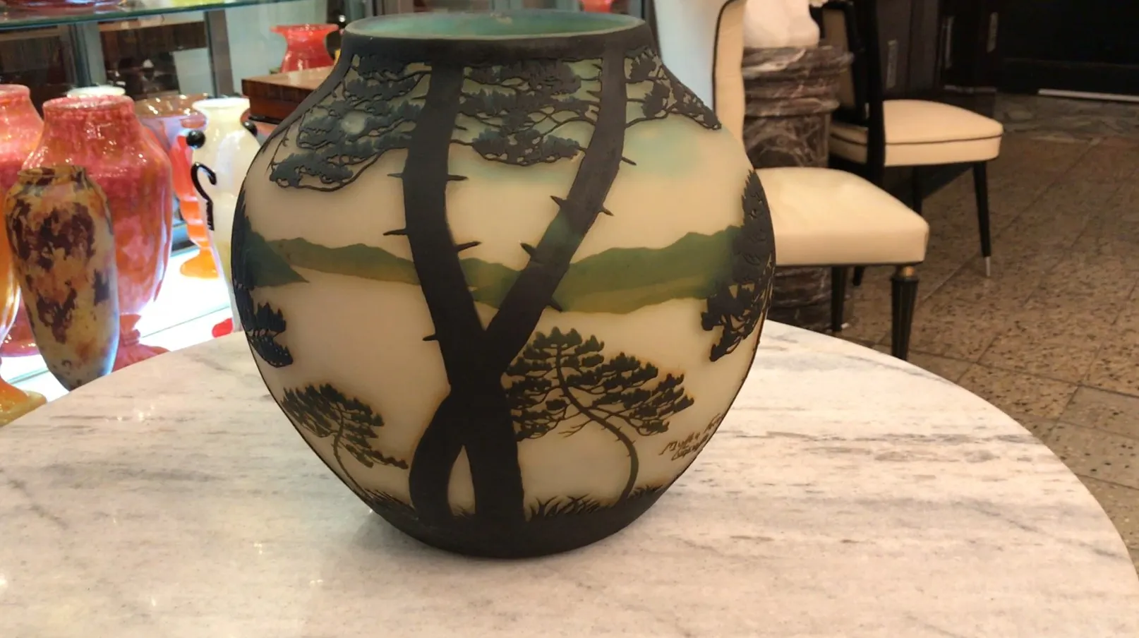 Beautiful signed glass by Muller Freres featuring landscapes and trees.