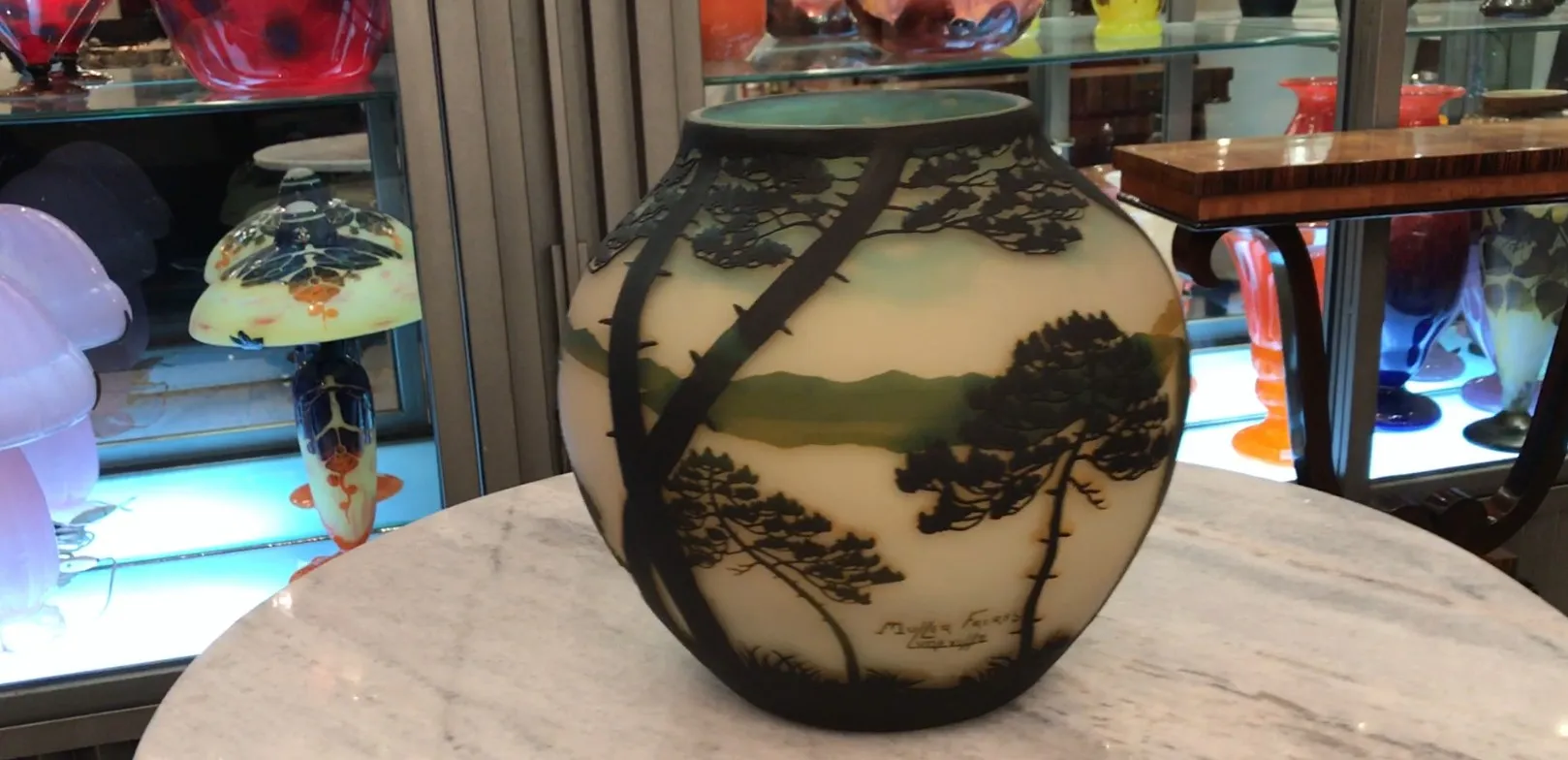 Antique signed glass Muller Fres featuring natural landscapes