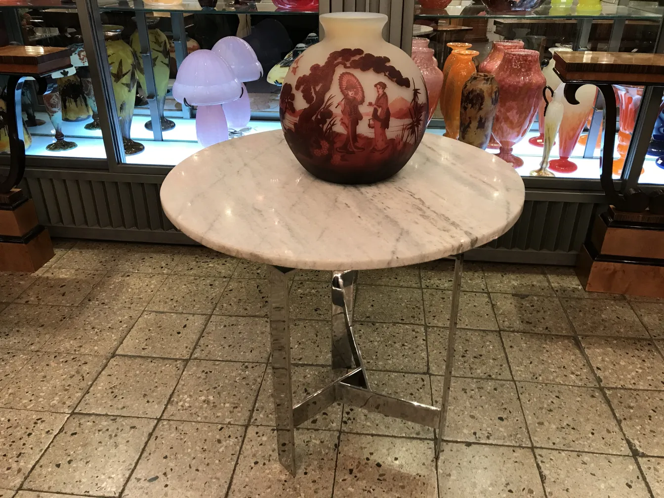 signed glass muller fres on marble table with antique objects