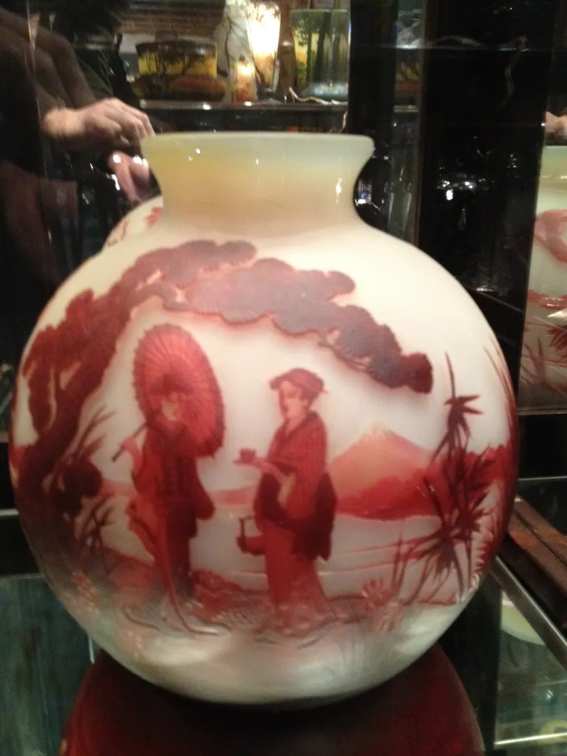 Signed glass by Muller Fres with oriental detail in red on white