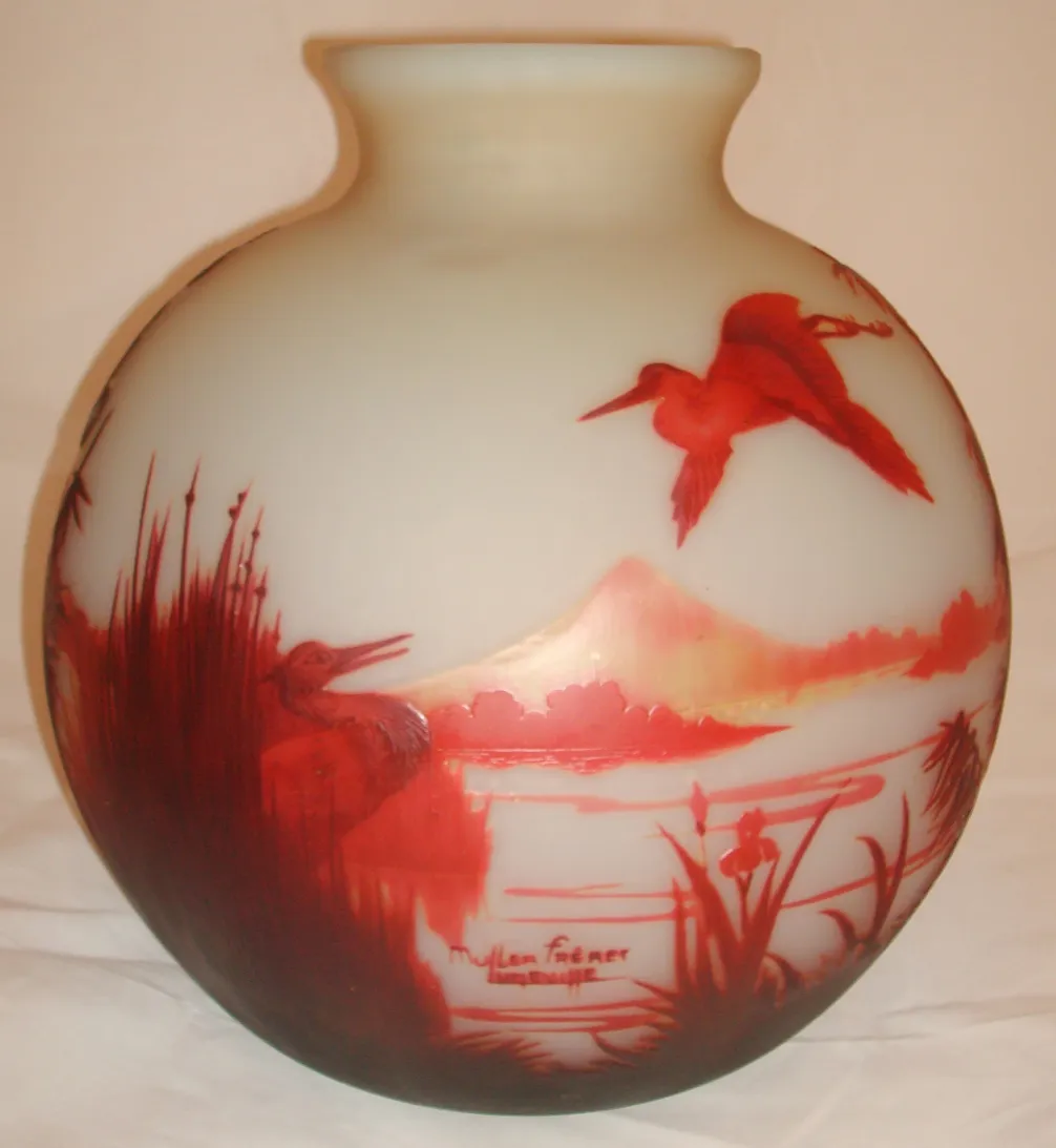 Spherical glass body with bird engravings on white background, antique Muller Freres.