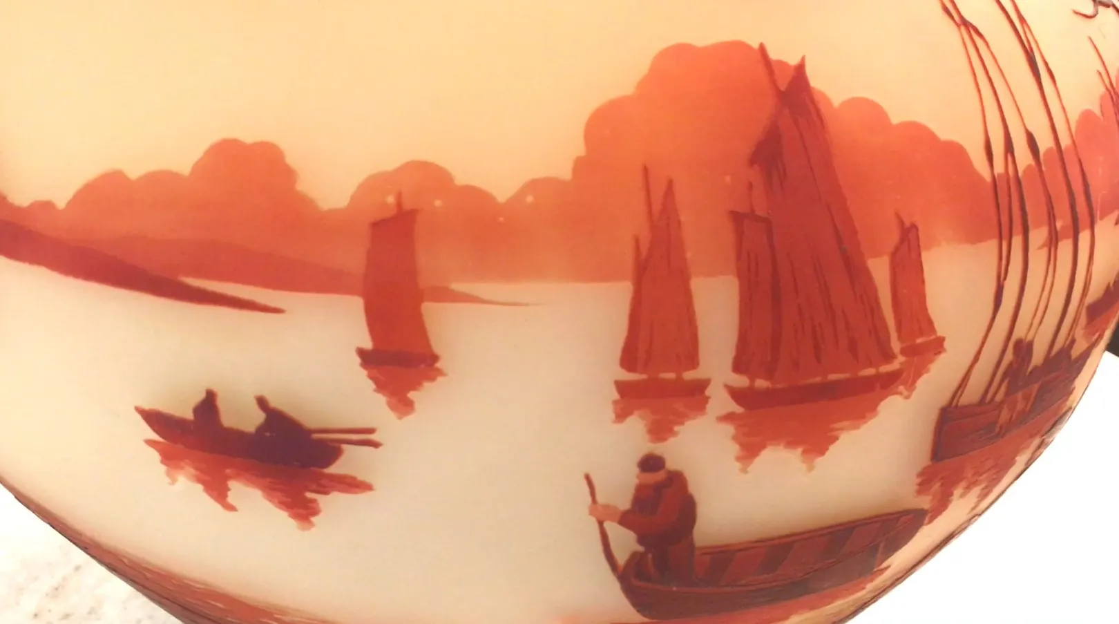 Antique signed glass Muller Freres featuring a coastal landscape in warm tones.