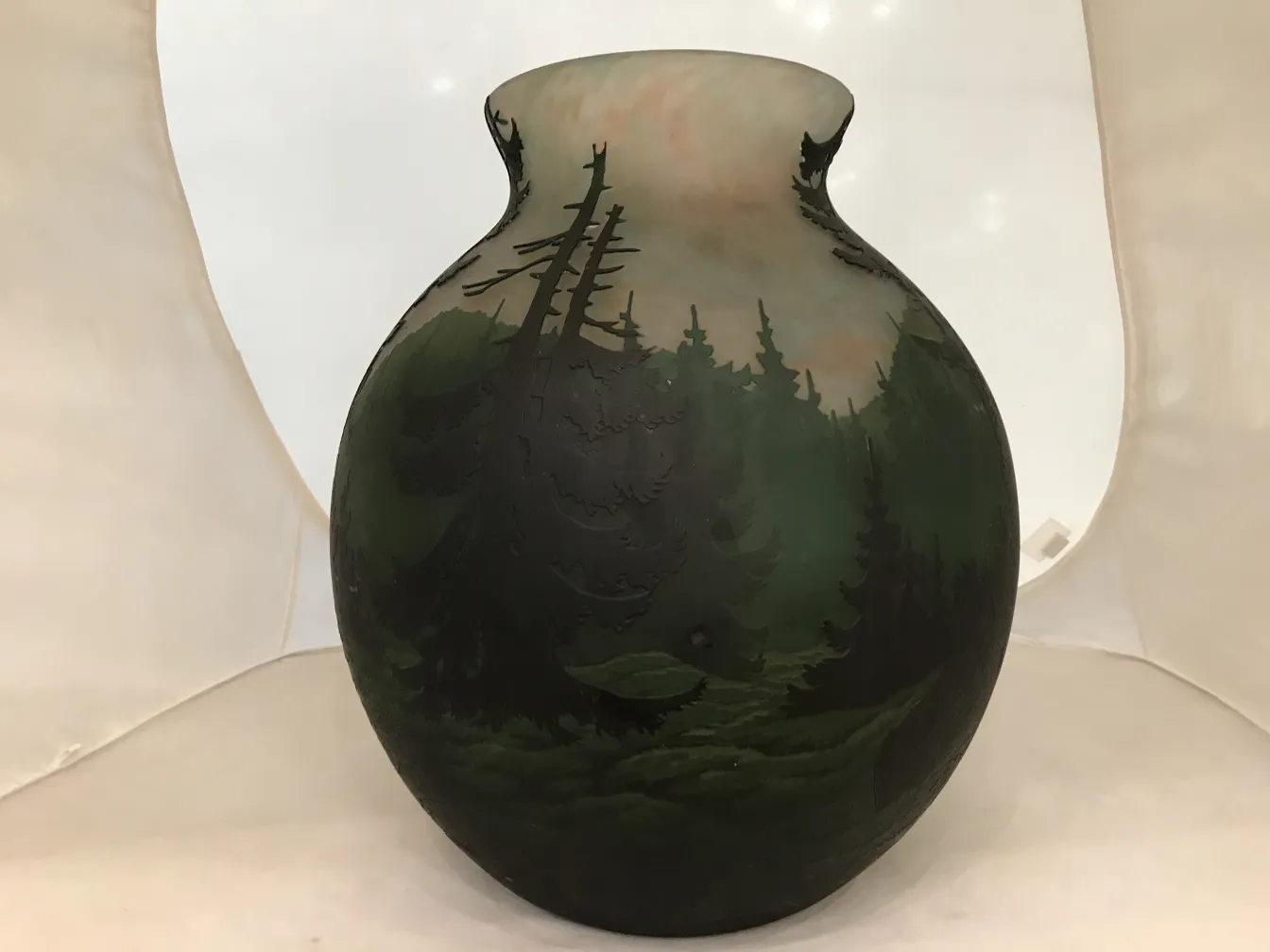 Antique glass signed by Muller Fres, natural scenery background.