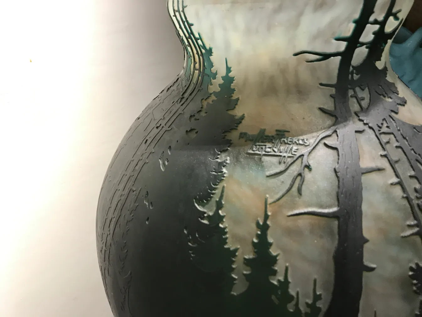 signed glass by Muller Fres featuring landscape and tree designs