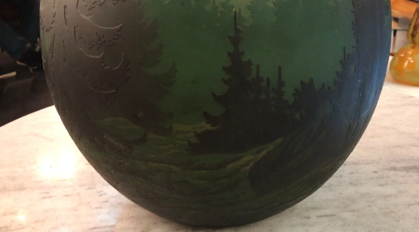 antique glass featuring a landscape, signed Muller Fres, green hues