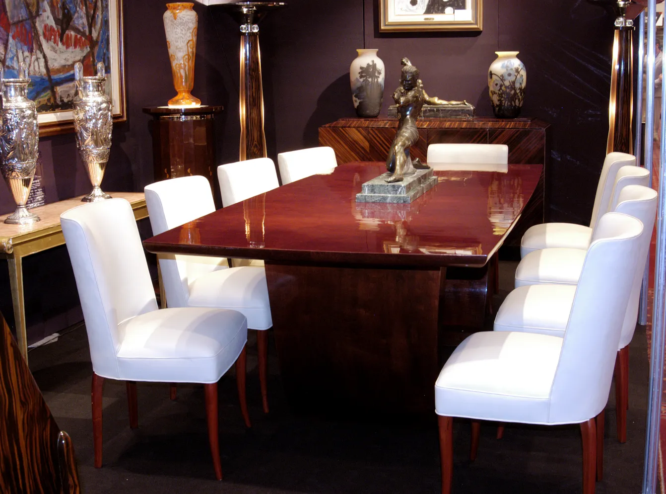 view of a table with chairs and decorative items, antiques