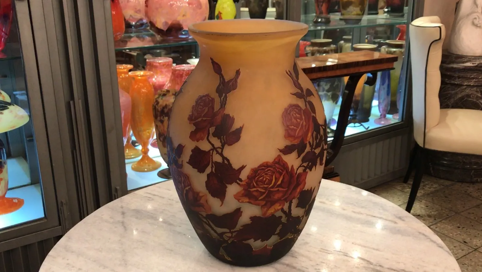 Signed glass muller fres featuring rose pattern in display