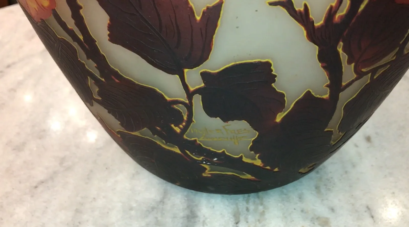 Signed glass by Muller Fres featuring leaf design, antique.