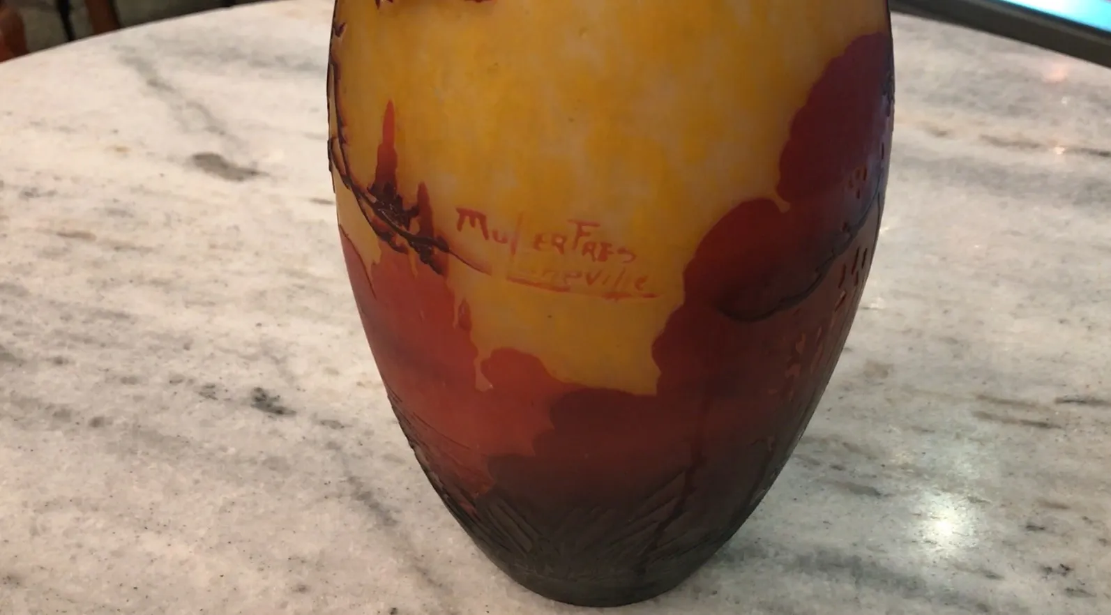 Antique glass signed by Muller Fres, warm colors.