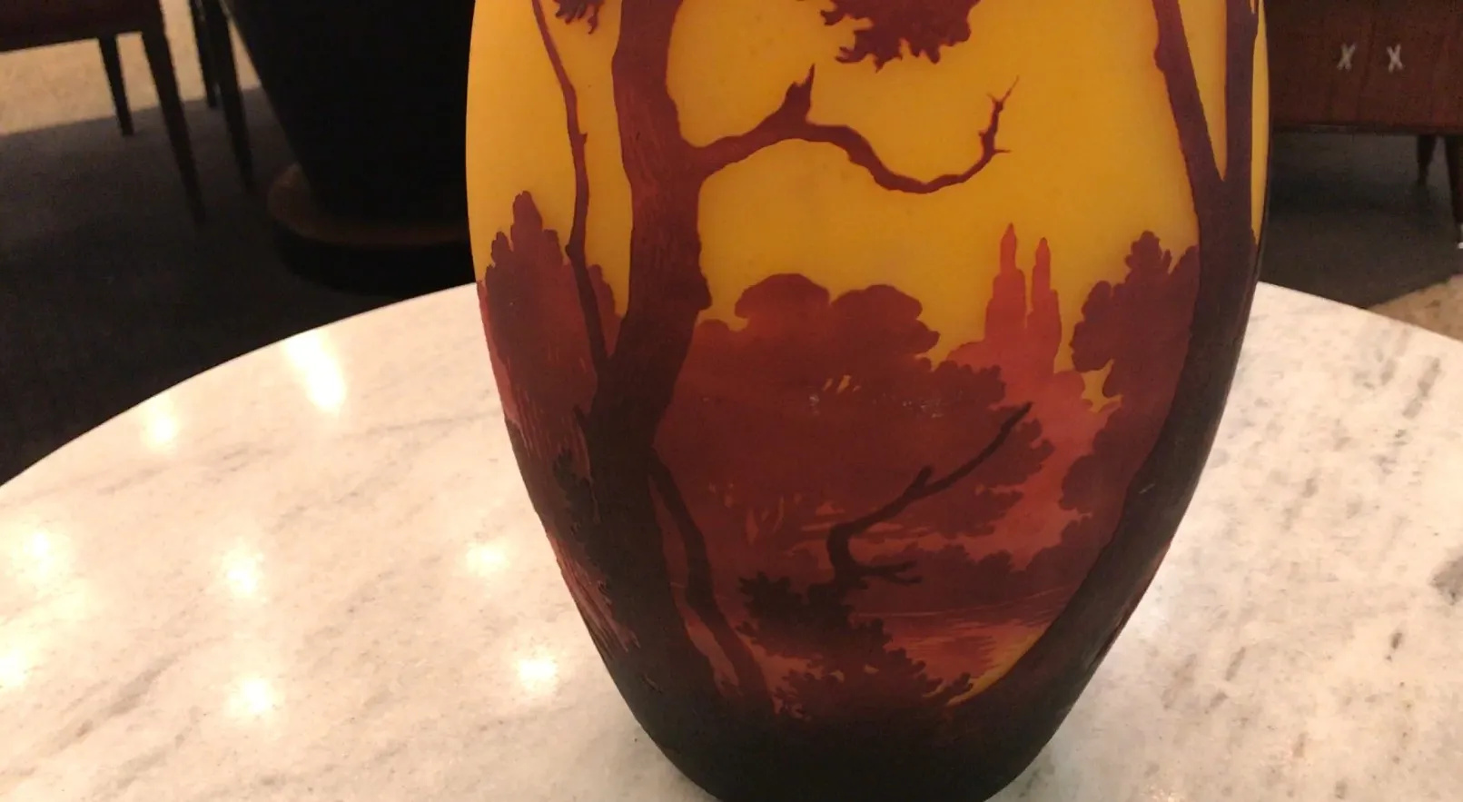 decorative vase in yellow and red shades with landscape