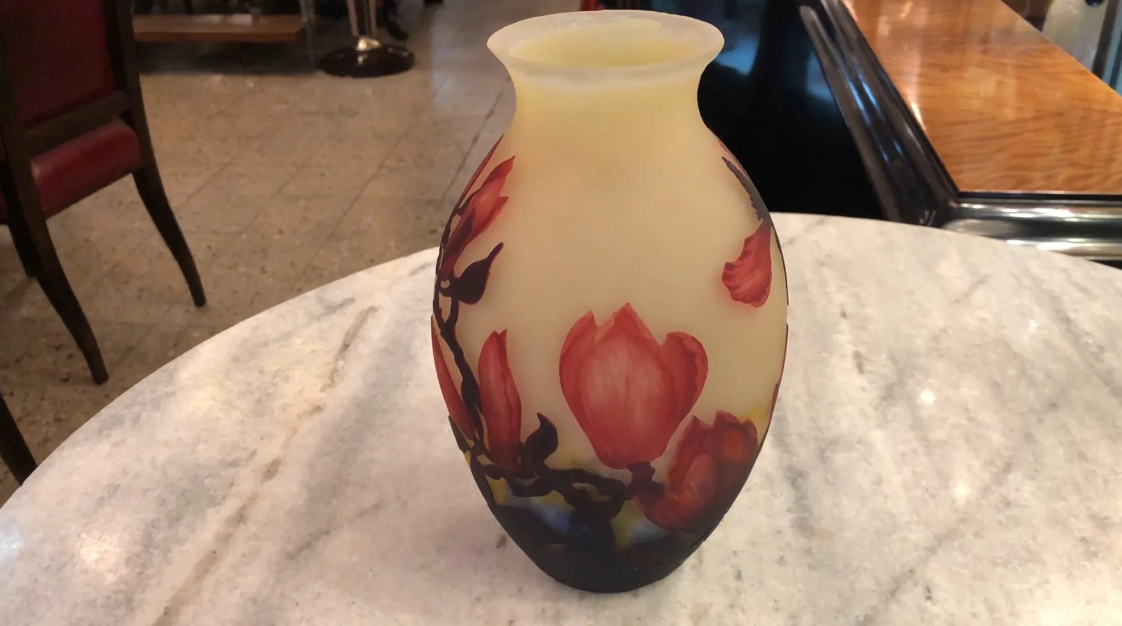 antique vase with floral designs in red and black
