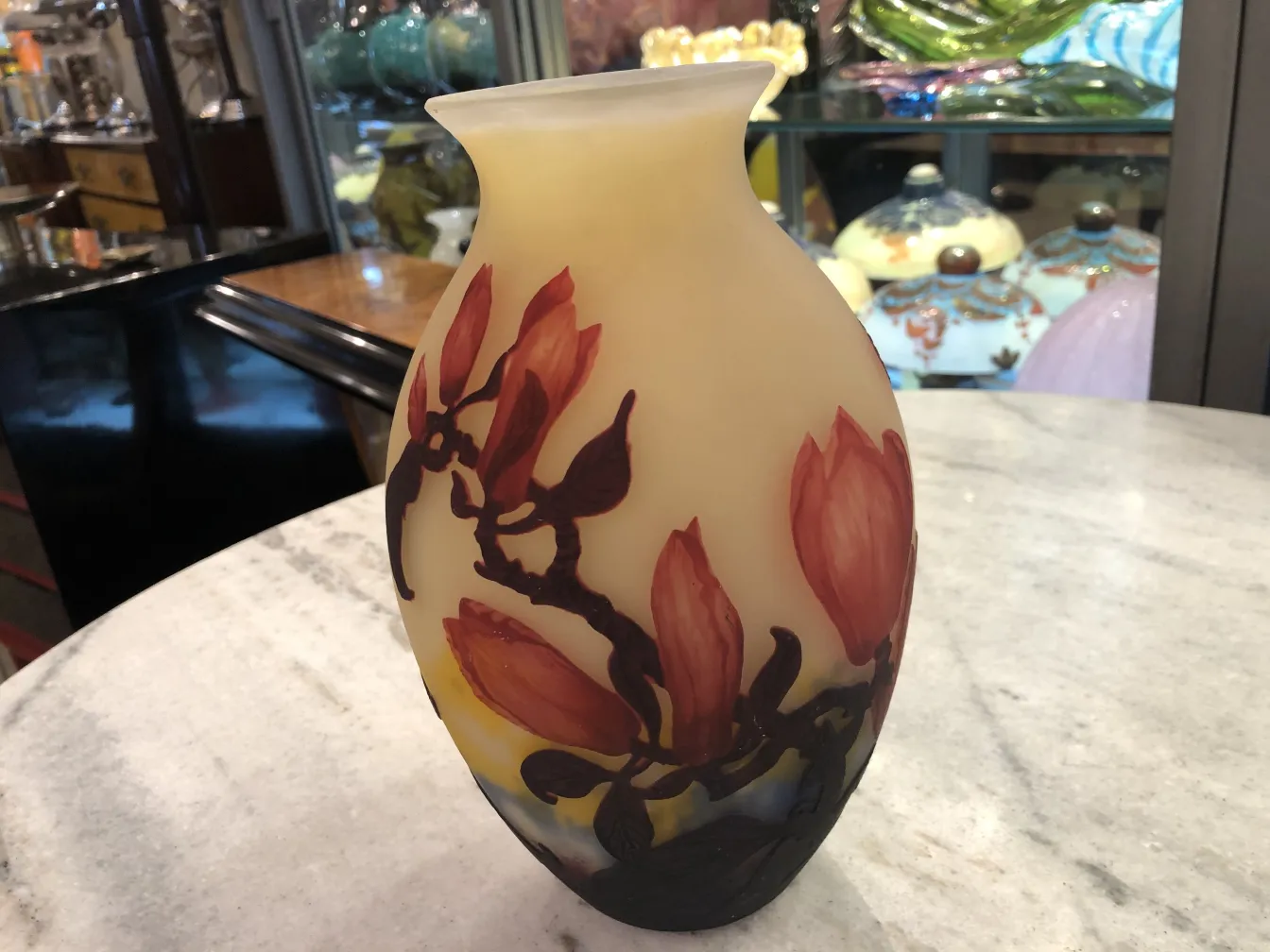 Antique glass vase signed by Muller Freres featuring floral designs.