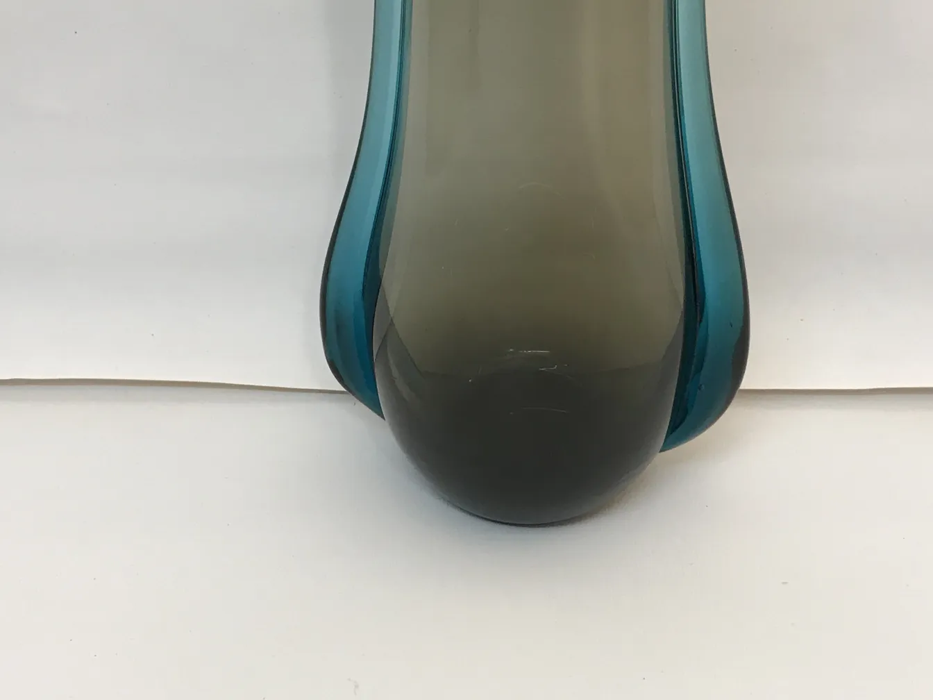 Antique Murano vase with elegant shape and soft colors on a light background.