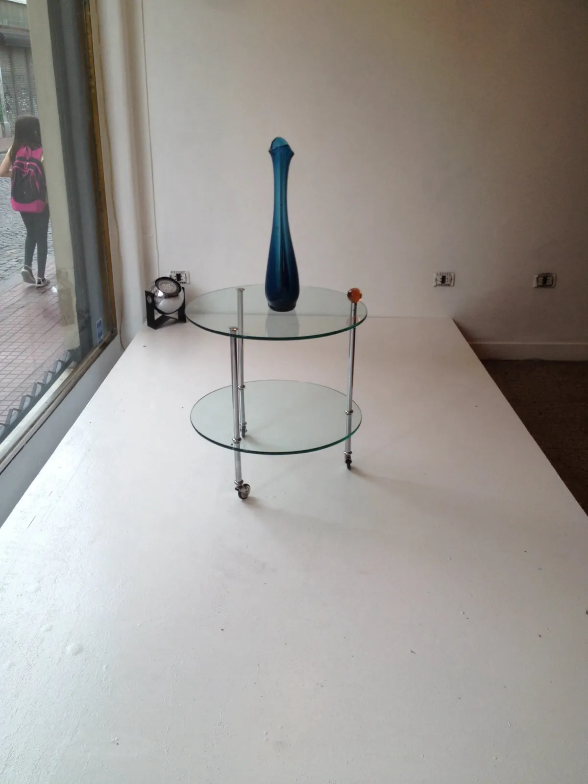 blue murano vase on a glass table