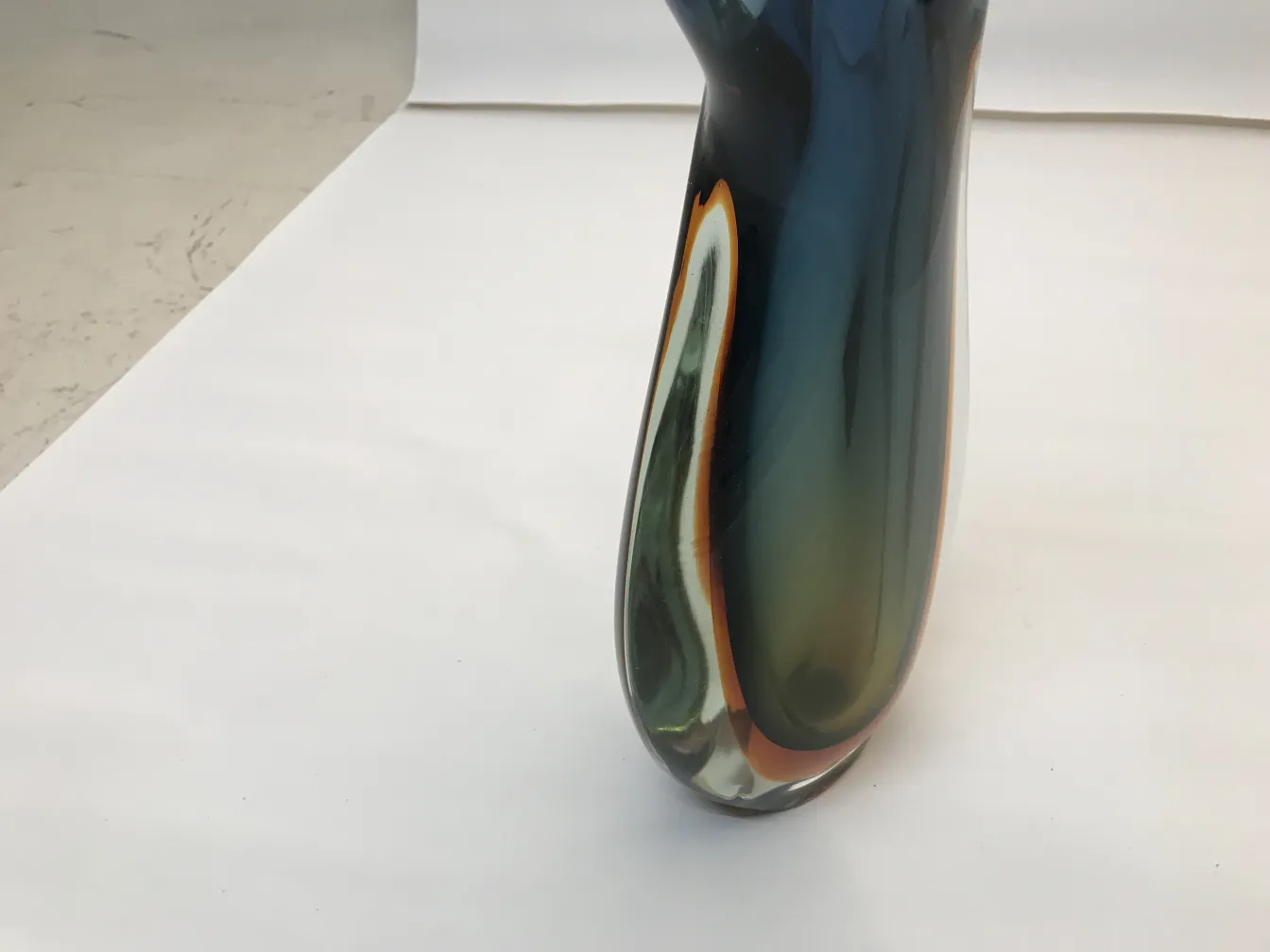 antique murano vase with vibrant colors and elegant shapes against a neutral background