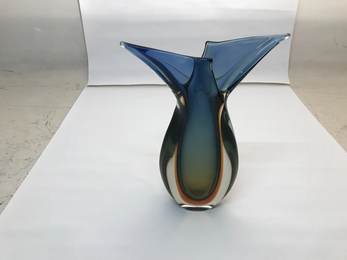antique murano vase featuring bright blue and green colors in a stylish shape