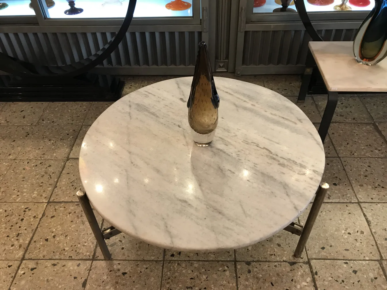 Elegant Murano vase on a round marble table