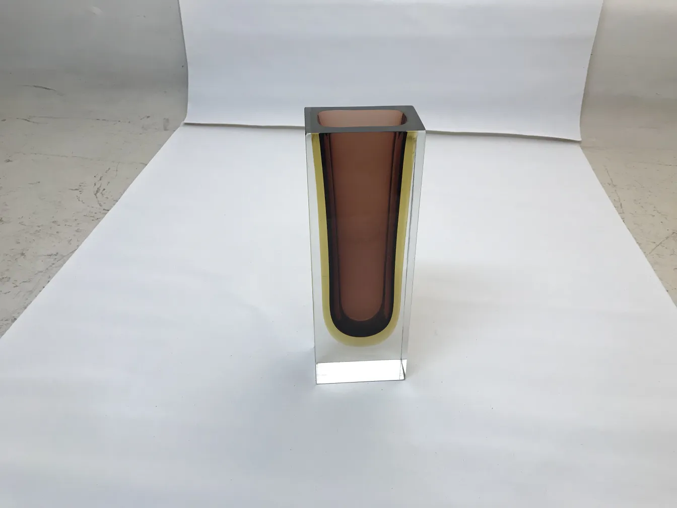 antique Murano vase with colorful design on a light background