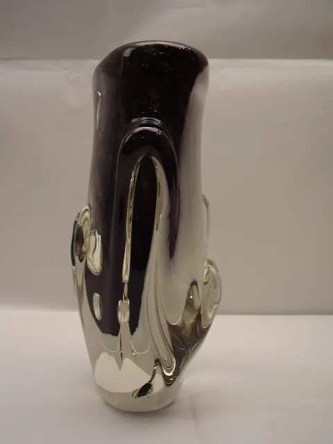 Elegant Murano vase in dark tones, featuring a minimalist and sophisticated backdrop.