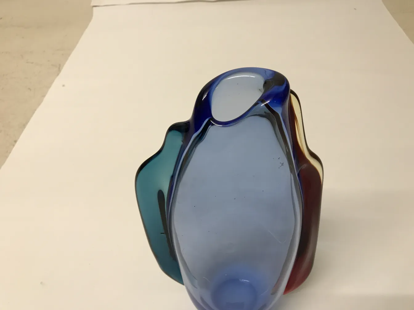 Antique Murano vase in blue and red tones, elegant and decorative.