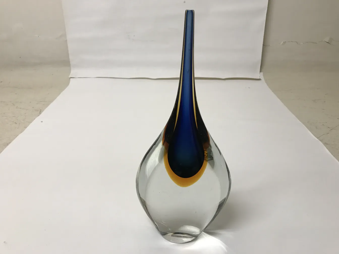 antique murano vase with blue and yellow colors, elegant shape on a white background