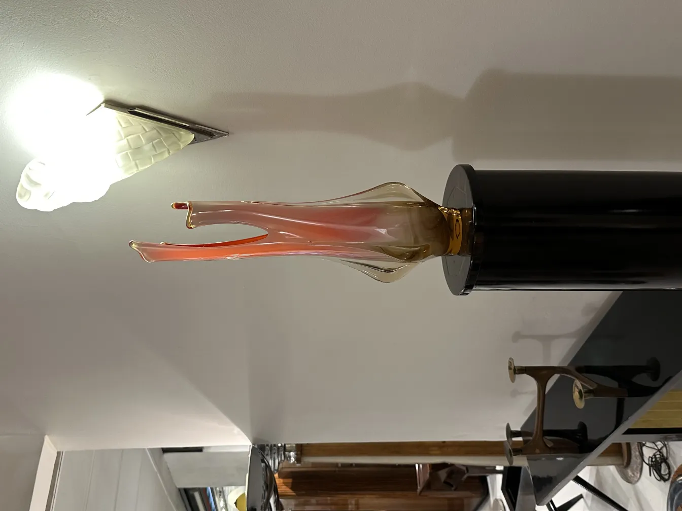 antique murano vase in an elegant shape within a decorative setting