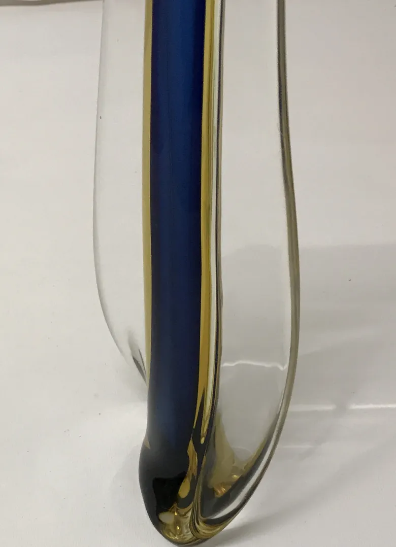 antique murano vase with curved shapes and blue color