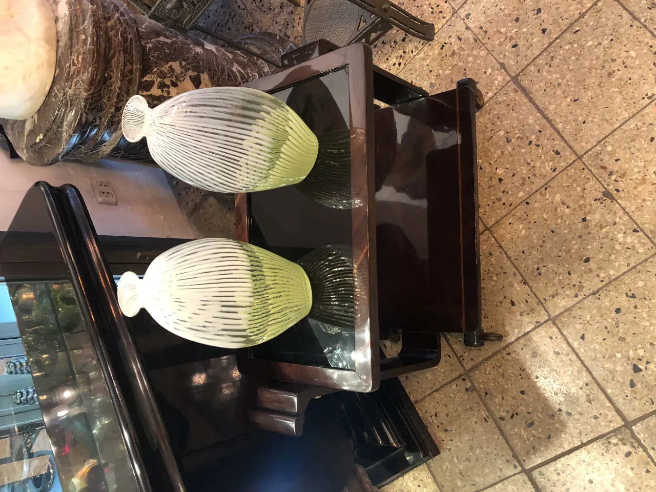 antique murano vase with decorative lines in light shades, on an elegant table