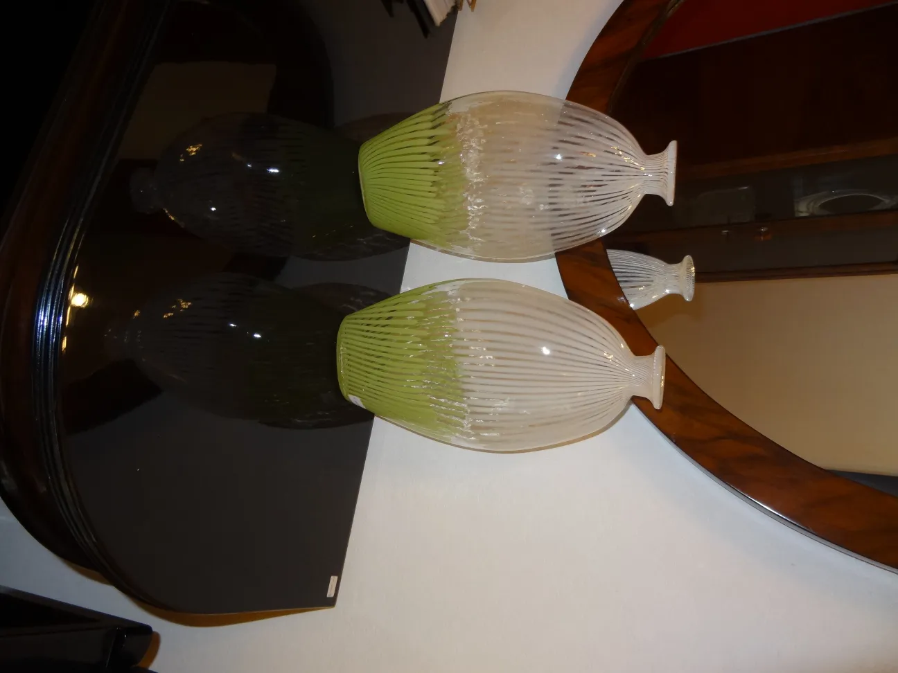 Antique Murano vase with decorative details in an elegant setting.